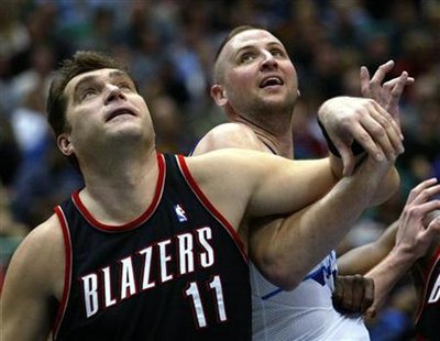 Portland Trailblazers center Arvydas Sabonis (L) boxes out Utah Jazz center greg Ostertag (R) for a rebound during the first half in Salt La Portland Trailblazers center Arvydas Sabonis (L) boxes out Utah Jazz center greg Ostertag (R) for a rebound during the first half in Salt La