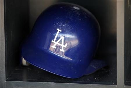 A batting helmet reflects the dugout of the Los Angeles Dodgers before game against Twins A batting helmet reflects the dugout of the Los Angeles Dodgers before game against Twins