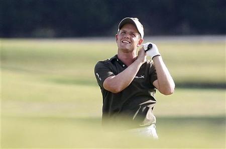 Luke Donald of Britain reacts reacts to his shot off the 17th fairway, during the final round of the Tour Championship PGA golf tournament i Luke Donald of Britain reacts reacts to his shot off the 17th fairway, during the final round of the Tour Championship PGA golf tournament i