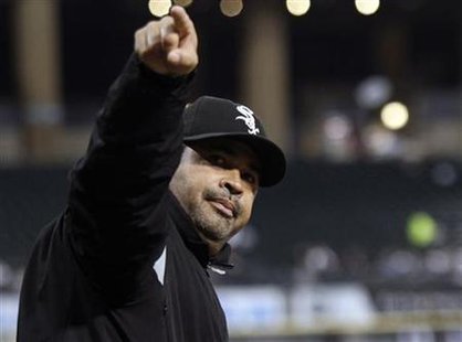 Chicago White Sox manager Ozzie Guillen points to the crowd during their MLB game against the Toronto Blue Jays in Chicago Chicago White Sox manager Ozzie Guillen points to the crowd during their MLB game against the Toronto Blue Jays in Chicago