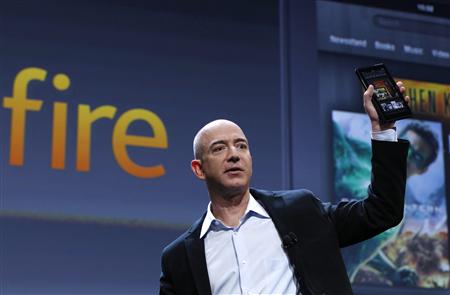 Amazon CEO Bezos holds up the new Kindle Fire tablet at news conference in New York Amazon CEO Bezos holds up the new Kindle Fire tablet at news conference in New York