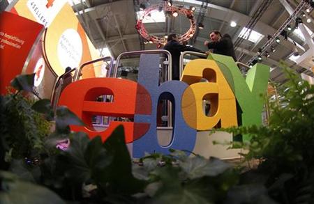 Visitors chat next to Ebay logo at CeBIT computer fair in Hanover Visitors chat next to Ebay logo at CeBIT computer fair in Hanover