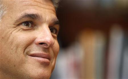 File photo of newly appointed Swiss bank UBS CEO Sergio Ermotti smiling during a Reuters interview in downtown Milan File photo of newly appointed Swiss bank UBS CEO Sergio Ermotti smiling during a Reuters interview in downtown Milan
