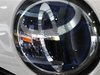People are reflected on a Toyota Motor vehicle logo at the company showroom in Tokyo