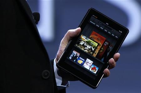Amazon CEO Bezos holds up the new Kindle Fire tablet at news conference in New York Amazon CEO Bezos holds up the new Kindle Fire tablet at news conference in New York