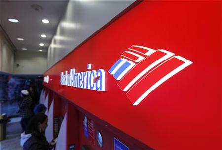Customers use ATM machines inside of a Bank of America branch in Times Square in New York Customers use ATM machines inside of a Bank of America branch in Times Square in New York
