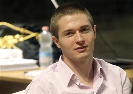 Raffaele Sollecito, the Italian student convicted of killing his British flatmate Meredith Kercher in Italy on November 2007, sits in the co Raffaele Sollecito, the Italian student convicted of killing his British flatmate Meredith Kercher in Italy on November 2007, sits in the co