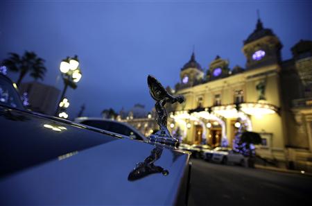 A luxury car is parked on Monte Carlo Casino square in Monaco A luxury car is parked on Monte Carlo Casino square in Monaco