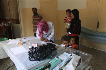 Doctors treat the children of families fleeing from the fighting in Sirte at a medical center in Herawa Doctors treat the children of families fleeing from the fighting in Sirte at a medical center in Herawa