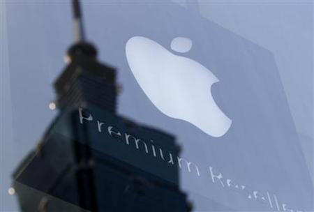 The Apple logo is seen against the reflection of Taiwan's landmark building Taipei 101 The Apple logo is seen against the reflection of Taiwan's landmark building Taipei 101