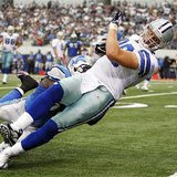 Cowboys tight end Phillips is tackled by Lions linebacker Tulloch in Arlington, Texas Cowboys tight end Phillips is tackled by Lions linebacker Tulloch in Arlington, Texas