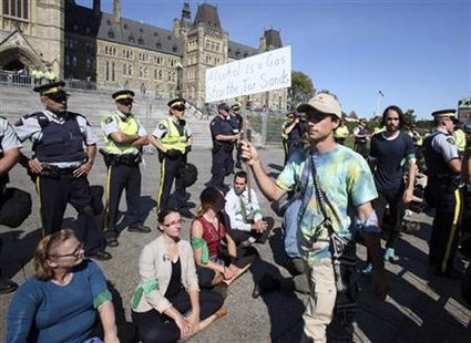 Demonstrators stage a "sit in" after crossing a police barricade during a protest against the Keystone XL pipeline on Parliament Hill in Ott Demonstrators stage a "sit in" after crossing a police barricade during a protest against the Keystone XL pipeline on Parliament Hill in Ott