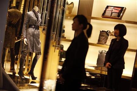 Staff members of the new Gucci flagship store in Shanghai walk around the store on its opening day Staff members of the new Gucci flagship store in Shanghai walk around the store on its opening day