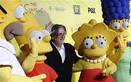 Groening, creator of The Simpsons, poses with characters from the show in Santa Monica Groening, creator of The Simpsons, poses with characters from the show in Santa Monica