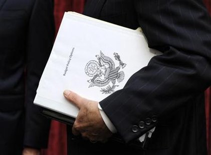 Congressional Super Committee member Sen. Jon Kyl (R-AZ) carries a binder titled Budget Policy Options as he departs the inaugural meeting, Congressional Super Committee member Sen. Jon Kyl (R-AZ) carries a binder titled Budget Policy Options as he departs the inaugural meeting,
