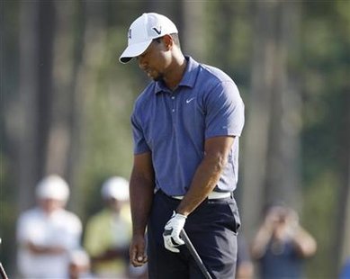 Tiger Woods of the U.S. reacts after his tee shot on the 18th hole during the second round of the 93rd PGA Championship golf tournament at t Tiger Woods of the U.S. reacts after his tee shot on the 18th hole during the second round of the 93rd PGA Championship golf tournament at t