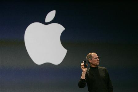 File photo of Apple Inc. CEO Steve Jobs holding new iPhone File photo of Apple Inc. CEO Steve Jobs holding new iPhone