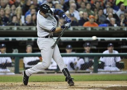 New York Yankees' Derek Jeter hits a two RBI double against the Detroit Tigers in the third inning of Game 4 in their MLB American League Division Series baseball playoffs in Detroit, Michigan, October 4, 2011. REUTERS/Mike Cassese (UNITED STATES - Tags: SPORT BASEBALL)
