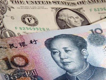 A picture illustration shows a U.S. one dollar and Chinese 10 Yuan bank notes A picture illustration shows a U.S. one dollar and Chinese 10 Yuan bank notes