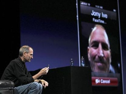 Apple CEO Steve Jobs demonstrates video conferencing with Apple Senior Vice President for Industrial Design Jonathan Ive at the unveiling of Apple CEO Steve Jobs demonstrates video conferencing with Apple Senior Vice President for Industrial Design Jonathan Ive at the unveiling of