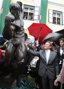 Austrian actor and former California governor Schwarzenegger unveils a statue of himself in a bodybuilding pose in Thal Austrian actor and former California governor Schwarzenegger unveils a statue of himself in a bodybuilding pose in Thal