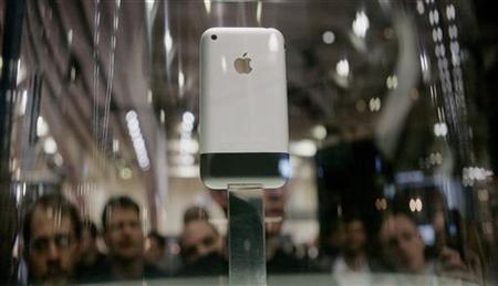 The new iPhone sits on display behind a glass case at the Macworld conference in San Francisco The new iPhone sits on display behind a glass case at the Macworld conference in San Francisco