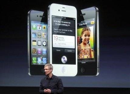 Apple CEO Tim Cook speaks in front of an image of an iPhone 4S at Apple headquarters in Cupertino Apple CEO Tim Cook speaks in front of an image of an iPhone 4S at Apple headquarters in Cupertino