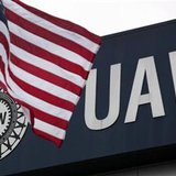 An American flag flies in front of the United Auto Workers union logo on the front of the UAW Solidarity House in Detroit An American flag flies in front of the United Auto Workers union logo on the front of the UAW Solidarity House in Detroit
