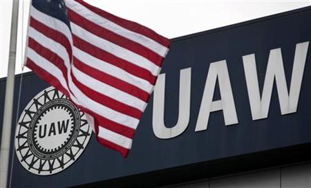 An American flag flies in front of the United Auto Workers union logo on the front of the UAW Solidarity House in Detroit An American flag flies in front of the United Auto Workers union logo on the front of the UAW Solidarity House in Detroit