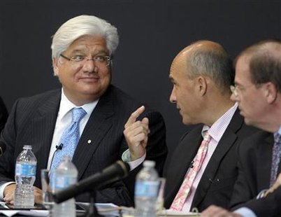 Research In Motion Co-CEOs Balsillie and Lazaridis talk during the annual general meeting of shareholders in Waterloo Research In Motion Co-CEOs Balsillie and Lazaridis talk during the annual general meeting of shareholders in Waterloo
