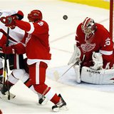 Ottawa Senators left wing Milan Michalek watches his shot fly past Detroit Red Wings defenseman Ian White and over goalie Jimmy Howard to sc