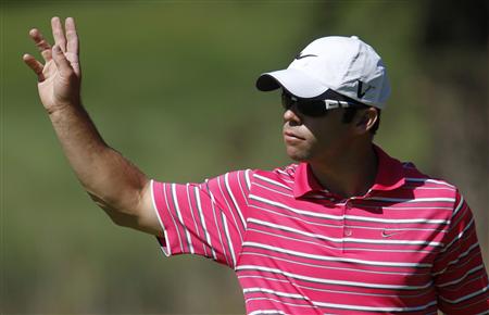 Paul Casey of Britain waves to the gallery after making birdie at the 18th hole during the second round of a PGA Tour golf tournament in San