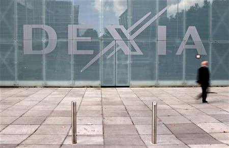 A man walks past the logo of Belgian-French financial services group Dexia outside the bank headquarters in central Brussels