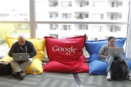 Attendees Dominie Liang and Ruslan Belkin utilize the common area at the Google I/O Developers Conference in the Moscone Center in San Franc Attendees Dominie Liang and Ruslan Belkin utilize the common area at the Google I/O Developers Conference in the Moscone Center in San Franc