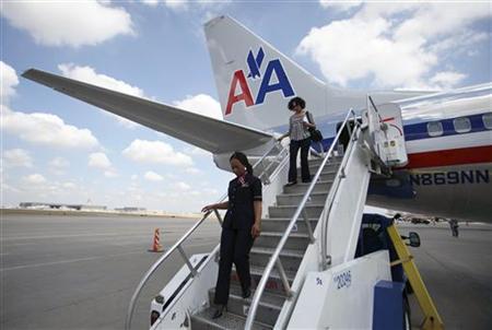 American Airlines flight attendant Stewart walks down from the rear exit of an American Airlines Boeing 737 at DFW International Airport in American Airlines flight attendant Stewart walks down from the rear exit of an American Airlines Boeing 737 at DFW International Airport in