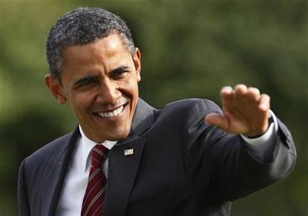 President Barack Obama waves as he walks on the South Lawn of the White House President Barack Obama waves as he walks on the South Lawn of the White House
