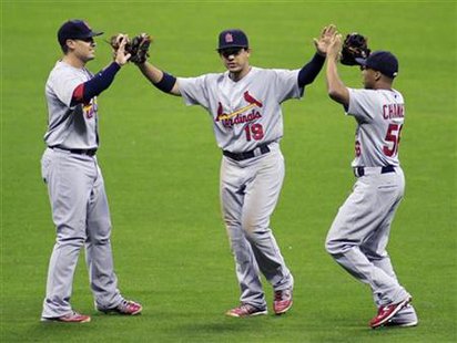 Cardinals' players celebrate defeating Brewers following Game 2 in their MLB National League Championship Series baseball playoff game in Mi Cardinals' players celebrate defeating Brewers following Game 2 in their MLB National League Championship Series baseball playoff game in Mi