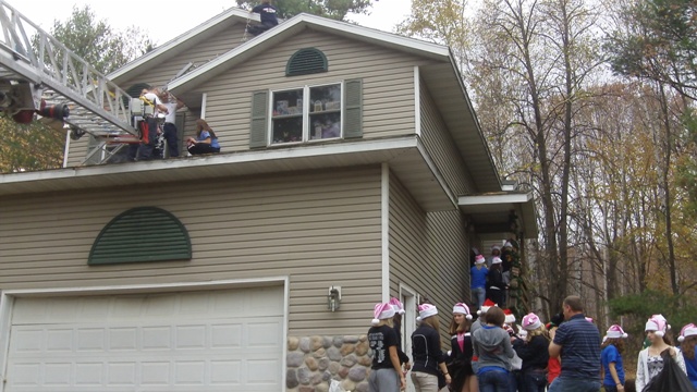 Kayleigh in Rib Mountain might not make it to Christmas. So today (Oct 11, 2011), the Rib Mountain Fire Department and Edgar High School students were there at the house to decorate so Kayleigh can have Christmas now. Mike Mathers was there playing Christmas music.