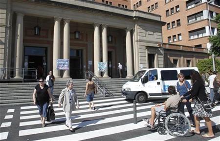 Banner against against cuts in public health hang at an entrance of Vall d'Hebron Hospital in Barcelona Banner against against cuts in public health hang at an entrance of Vall d'Hebron Hospital in Barcelona
