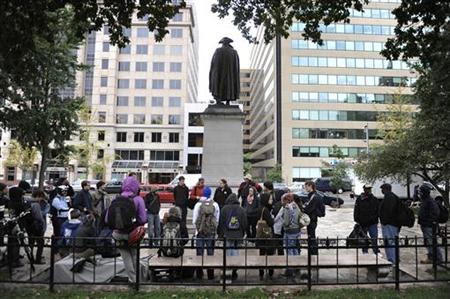 Protesters hold a meeting as they begin an Occupy DC demonstration in Washington Protesters hold a meeting as they begin an Occupy DC demonstration in Washington