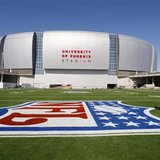 The NFL's head groundskeeper George Toma walks the field for Super Bowl XLII outside the University of Phoenix stadium in Glendale