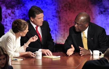 Republican presidential hopefuls Rep. Michele Bachmann, Texas Gov. Rick Perry and businessman Herman Cain talk during a break in their debat Republican presidential hopefuls Rep. Michele Bachmann, Texas Gov. Rick Perry and businessman Herman Cain talk during a break in their debat