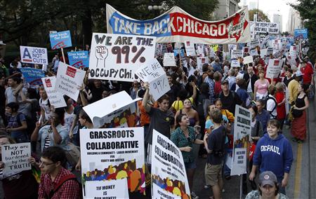 Members of a coalition called "Stand up Chicago" march during a protest down Michigan Ave in Chicago