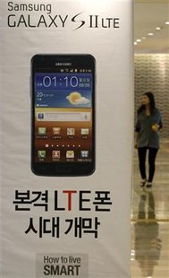 A woman walks past a billboard of Samsung Electronics' smart phone Galaxy S II LTE at the company's headquarters in Seoul A woman walks past a billboard of Samsung Electronics' smart phone Galaxy S II LTE at the company's headquarters in Seoul