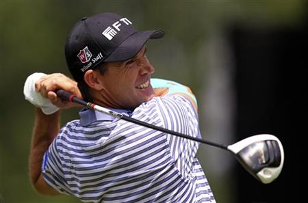 Ireland's Harrington tees off on 14th hole during first round of WGC Bridgestone Invitational PGA golf tournament at Firestone Country Club Ireland's Harrington tees off on 14th hole during first round of WGC Bridgestone Invitational PGA golf tournament at Firestone Country Club