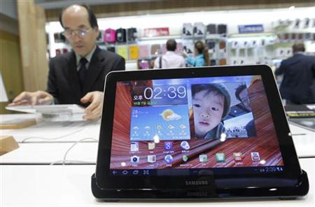 A man uses Samsung Electronics' tablet Galaxy Tab 10.1 displayed for customers at the company's headquarters in Seoul A man uses Samsung Electronics' tablet Galaxy Tab 10.1 displayed for customers at the company's headquarters in Seoul