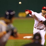 St. Louis Cardinals starting pitcher Chris Carpenter throws to Milwaukee Brewers' Corey Hart in the 1st inning of Game 3 of the MLB National St. Louis Cardinals starting pitcher Chris Carpenter throws to Milwaukee Brewers' Corey Hart in the 1st inning of Game 3 of the MLB National