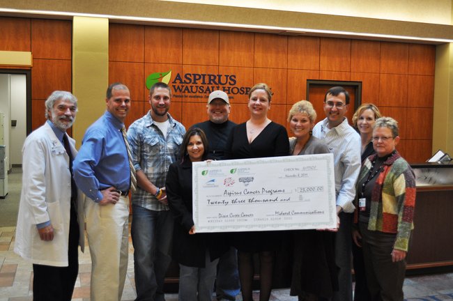 WIFC presents a check for $23,000 to Aspirus Cancer Care.