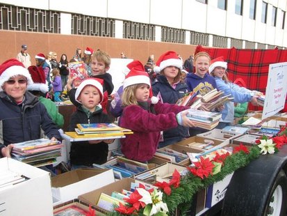 Kids hands out books at the 2010 Kalamazoo Holiday Parade. Kids hands out books at the 2010 Kalamazoo Holiday Parade.