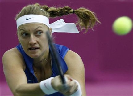 The Czech Republic's Kvitova hits a return against Russia's Kuznetsova during their Fed Cup World Group final tennis match in Moscow The Czech Republic's Kvitova hits a return against Russia's Kuznetsova during their Fed Cup World Group final tennis match in Moscow
